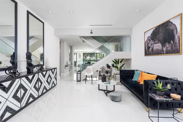 a kitchen with stainless steel appliances a sink a stove and cabinets