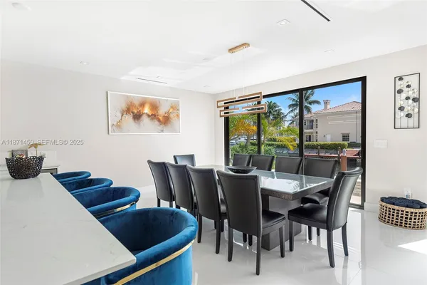 a kitchen with white cabinets and counter space