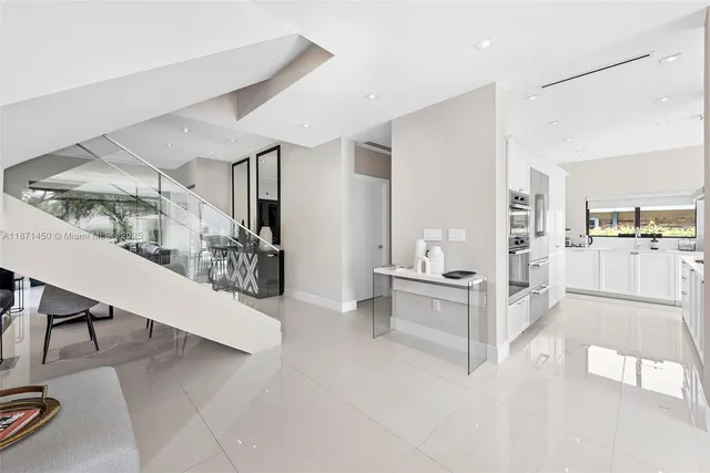 a bedroom with a large bed and a large window