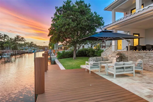 a view of a patio with a table chairs and a patio