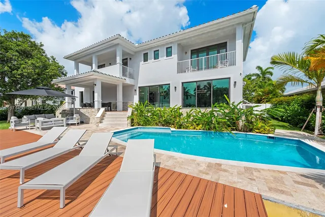 a living room with a bed and a window