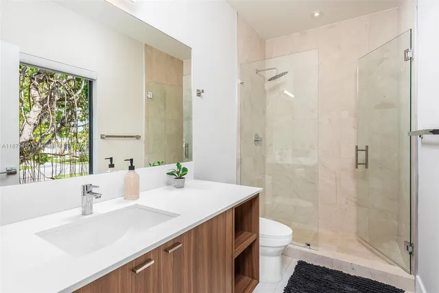 a view of an outdoor sitting area with furniture and umbrella