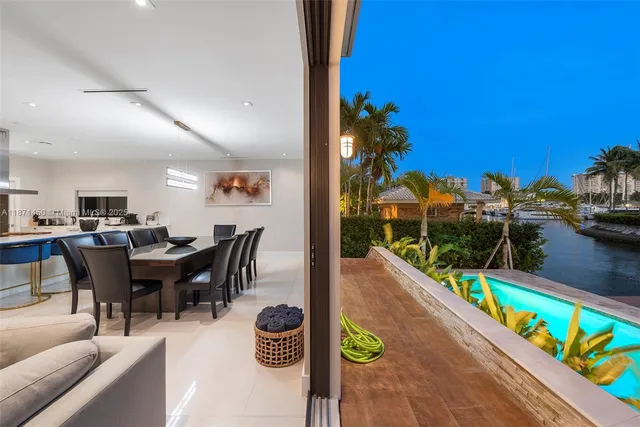a view of a chairs and table in a backyard