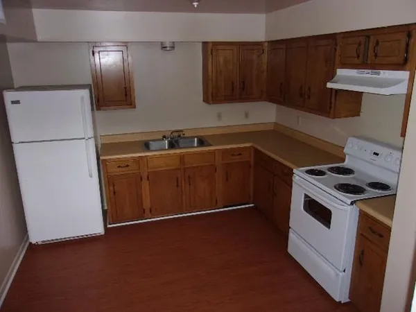 a kitchen with a stove and a microwave