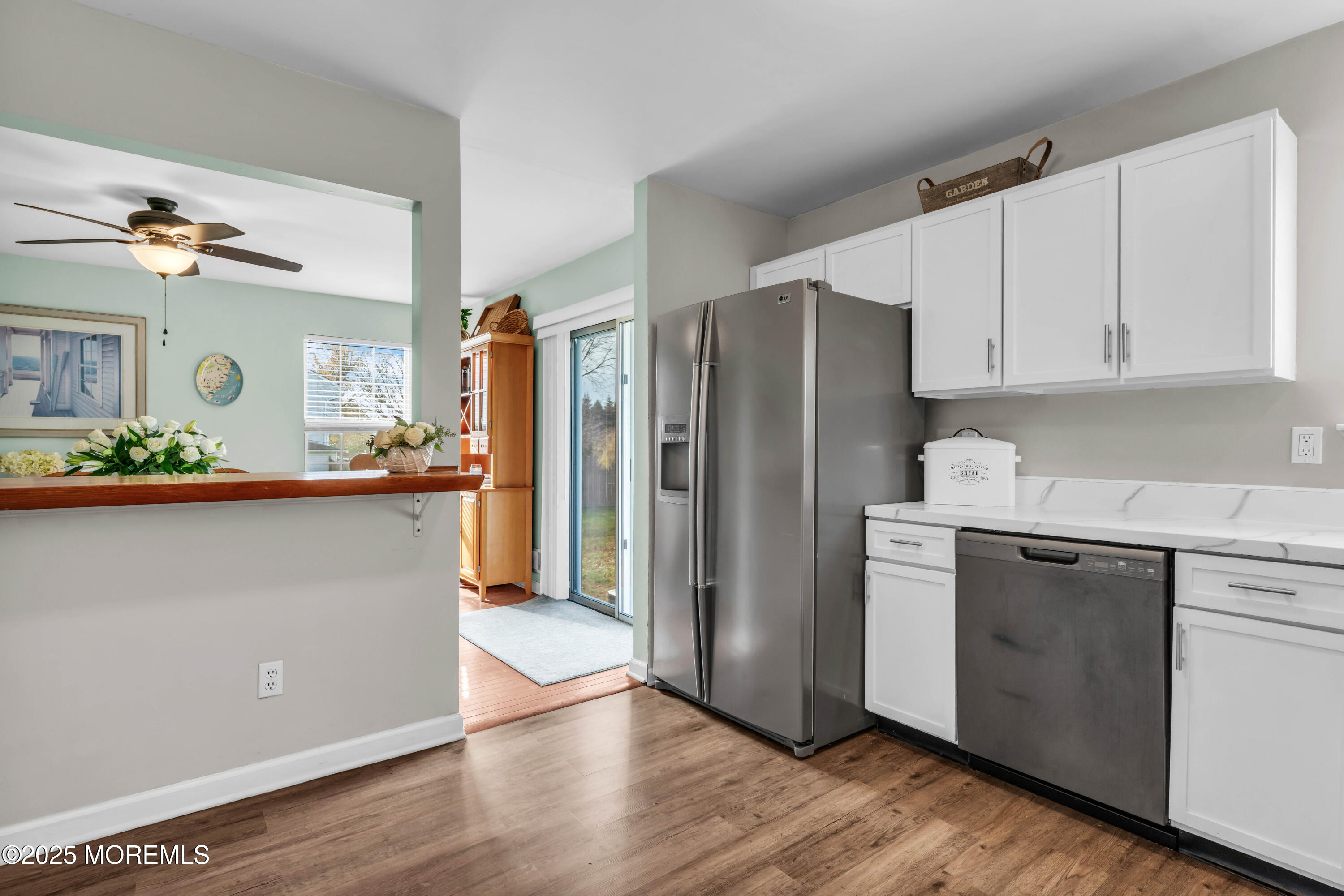 6 Hummingbird Way Jackson, NJ 08527 - Photo 11 of 39 a kitchen with granite countertop a refrigerator and a sink
