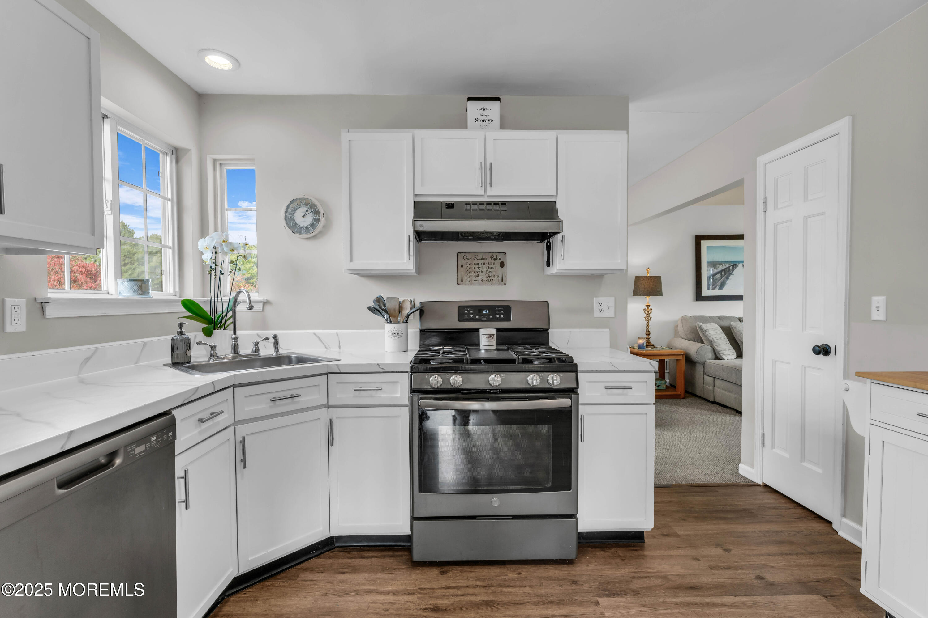 6 Hummingbird Way Jackson, NJ 08527 - Photo 8 of 39 a kitchen with stainless steel appliances white cabinets and a stove