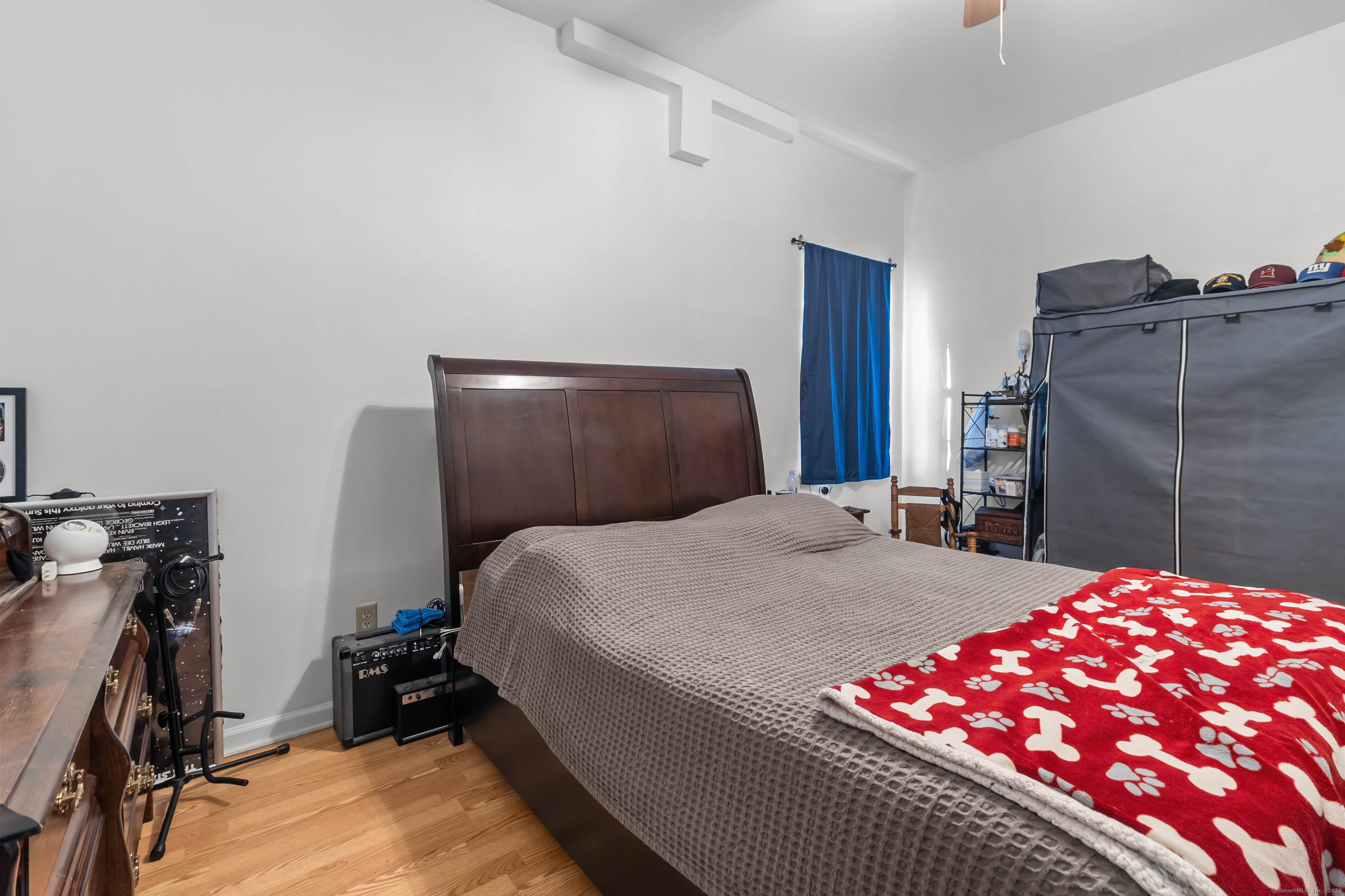 136 Washington Street Norwich, CT 06360 - Photo 13 of 40 a bedroom with a bed and a closet