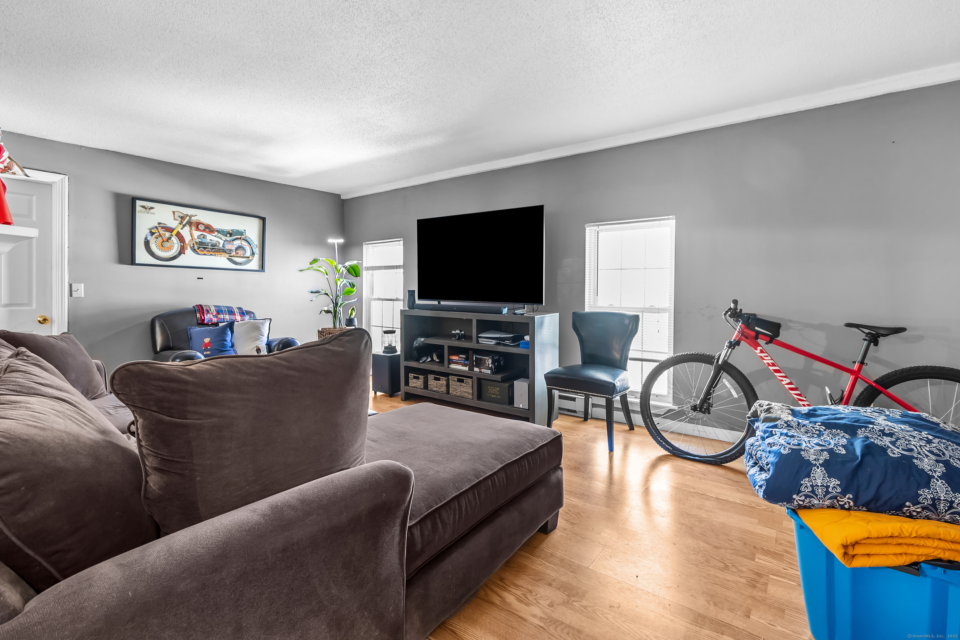 136 Washington Street Norwich, CT 06360 - Photo 15 of 40 a living room with furniture and a flat screen tv