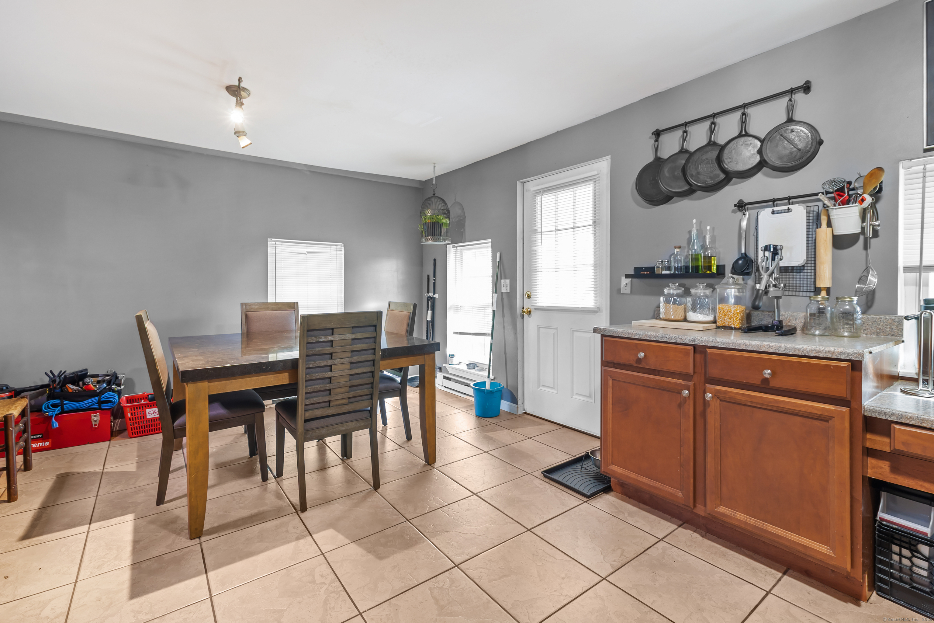 136 Washington Street Norwich, CT 06360 - Photo 19 of 40 a kitchen with a sink and cabinets