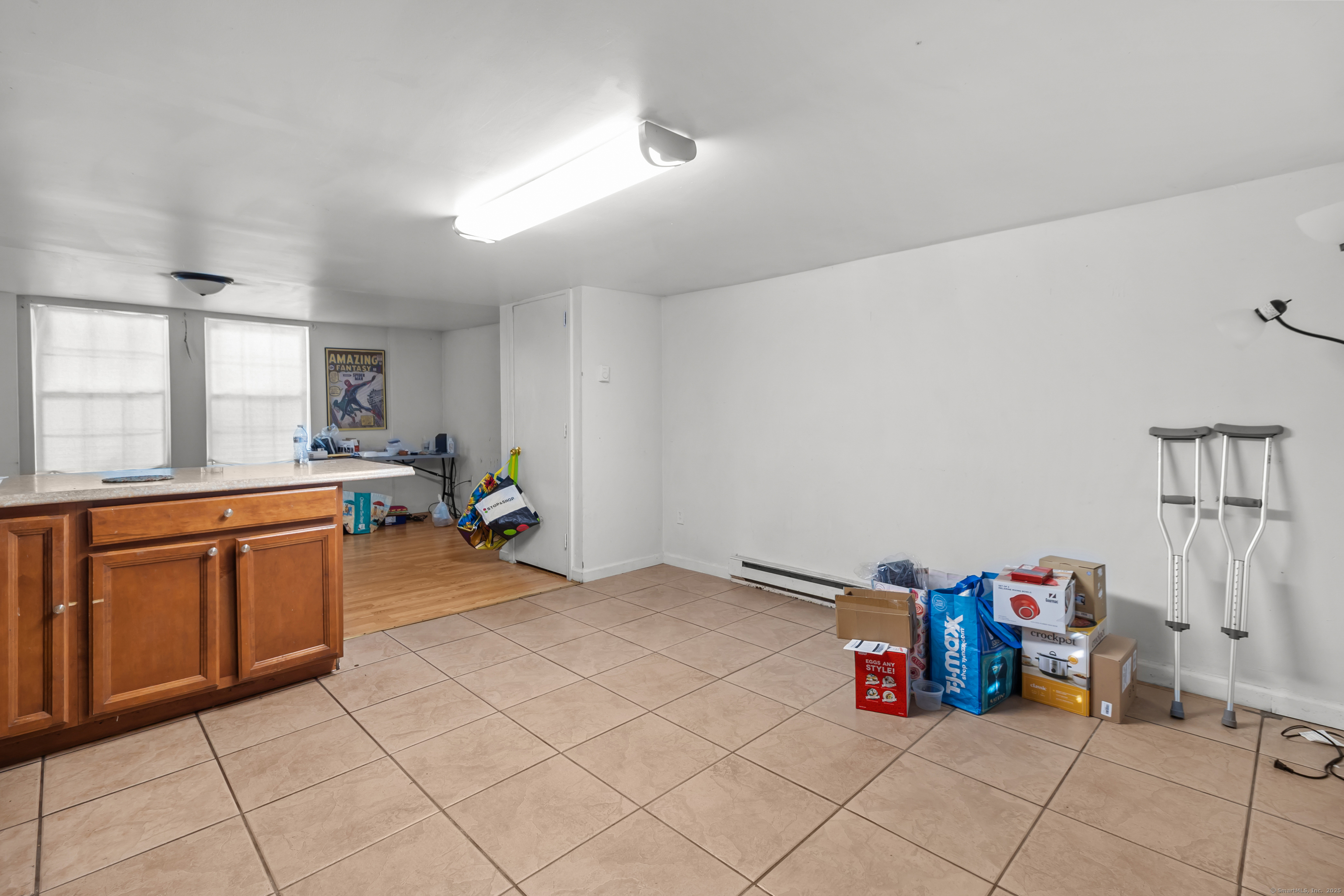 136 Washington Street Norwich, CT 06360 - Photo 30 of 40 a kitchen with stainless steel appliances kitchen island granite countertop a sink and cabinets