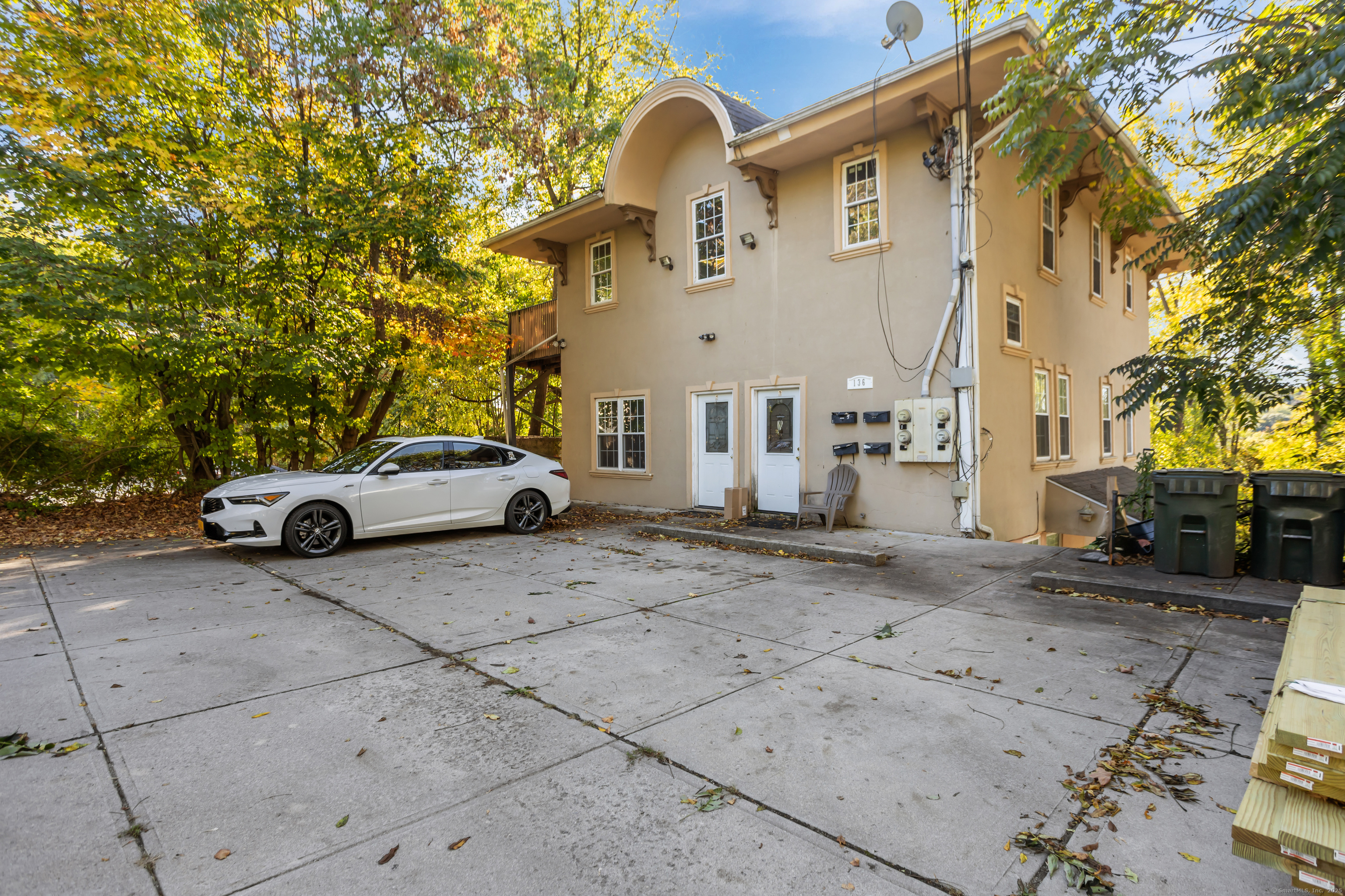 136 Washington Street Norwich, CT 06360 - Photo 3 of 40 a view of a car park in front of a building