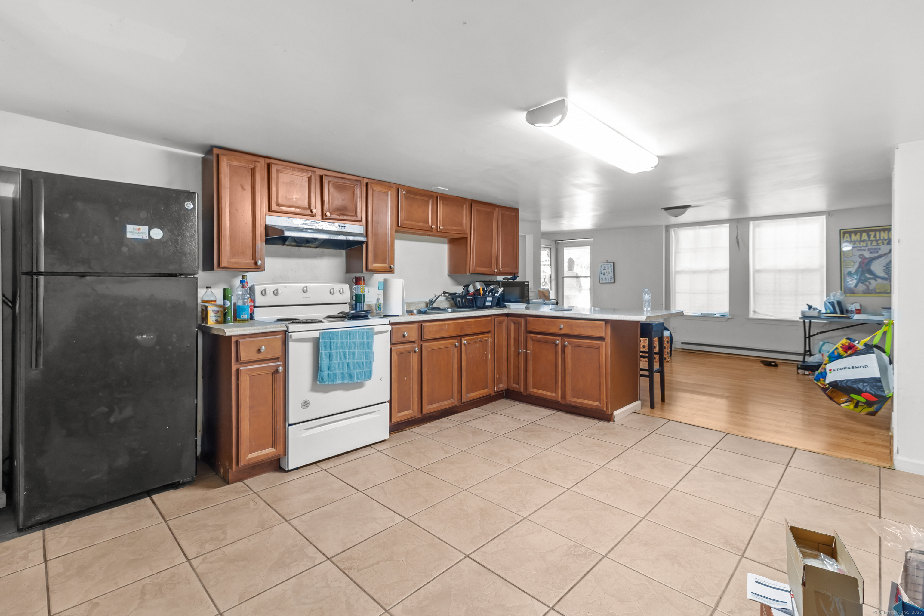 136 Washington Street Norwich, CT 06360 - Photo 31 of 40 a kitchen with stainless steel appliances granite countertop a refrigerator and a sink