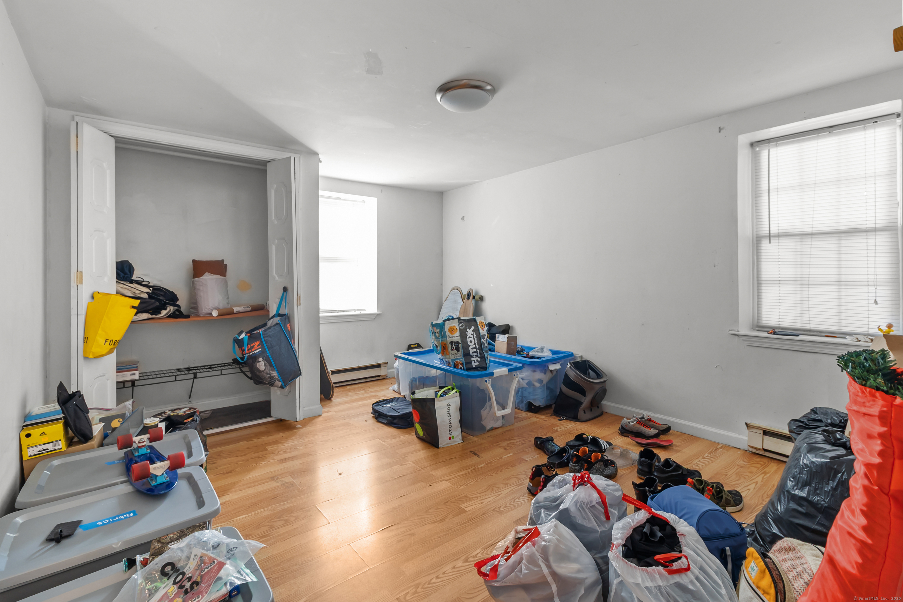 136 Washington Street Norwich, CT 06360 - Photo 32 of 40 a room with furniture and a wooden floor