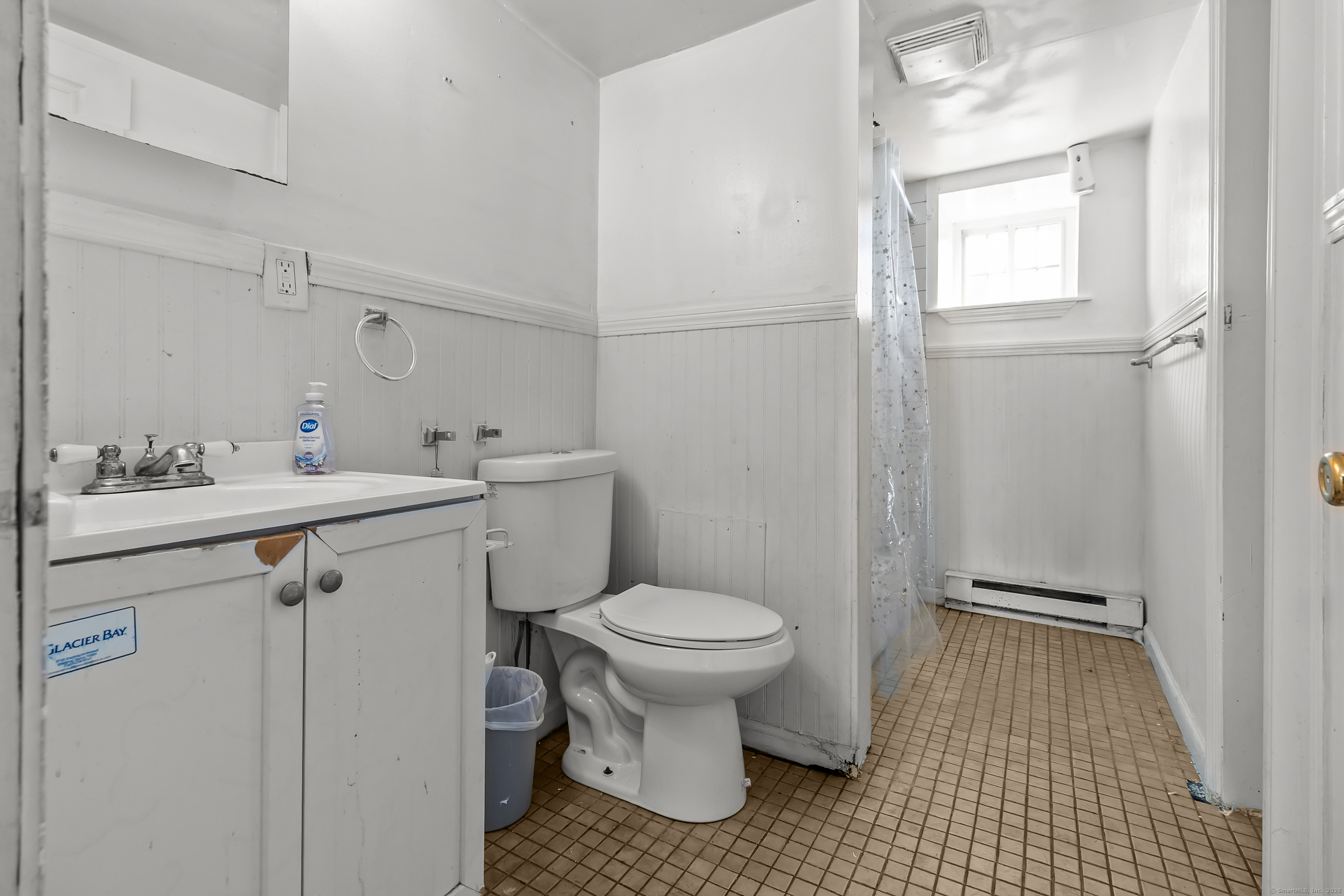 136 Washington Street Norwich, CT 06360 - Photo 37 of 40 a bathroom with a sink toilet and shower