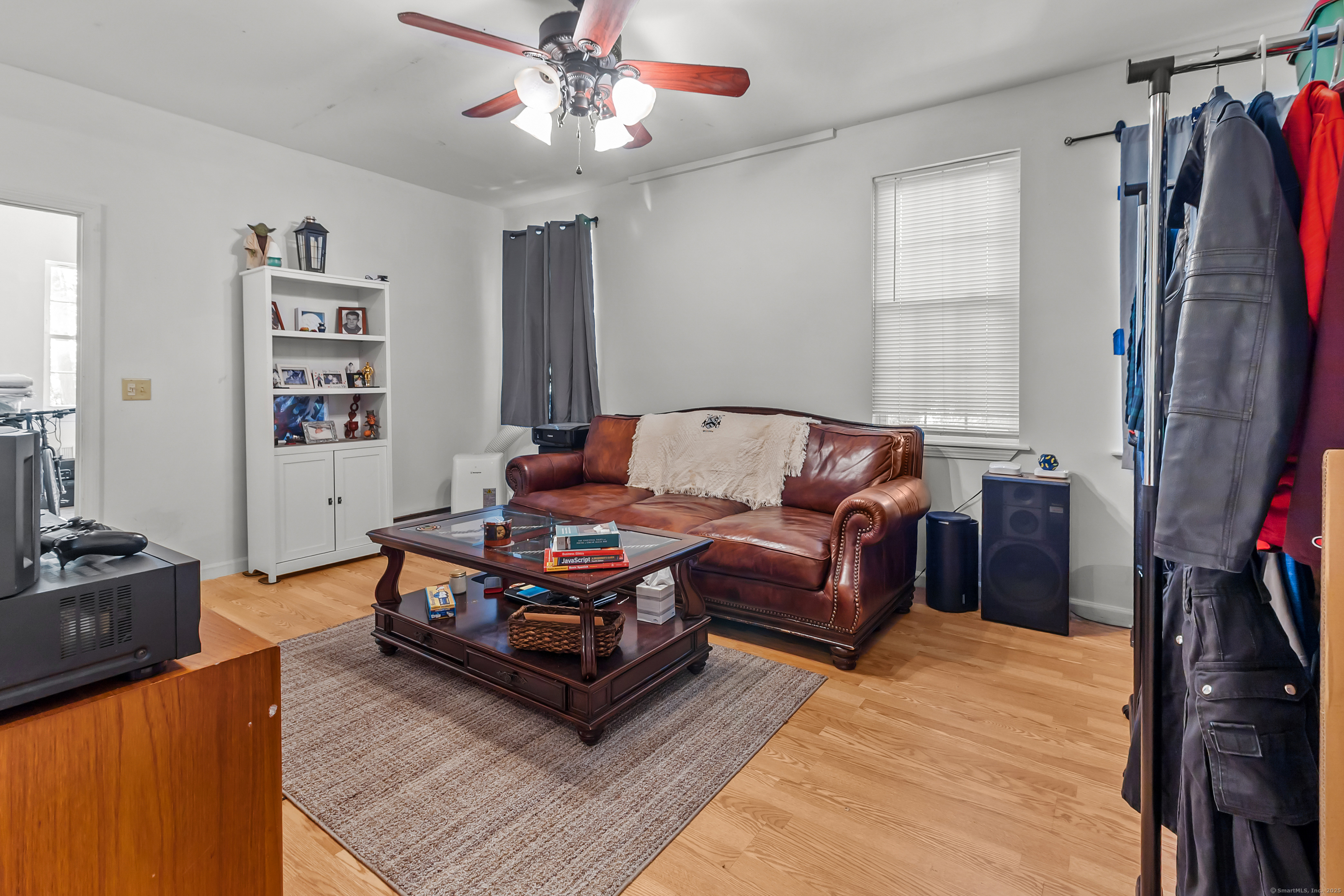 136 Washington Street Norwich, CT 06360 - Photo 7 of 40 a living room with furniture a flat screen tv and a window