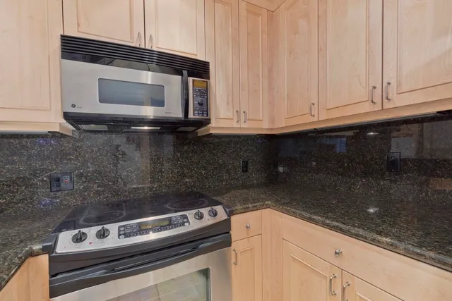 a kitchen with a stove and a microwave