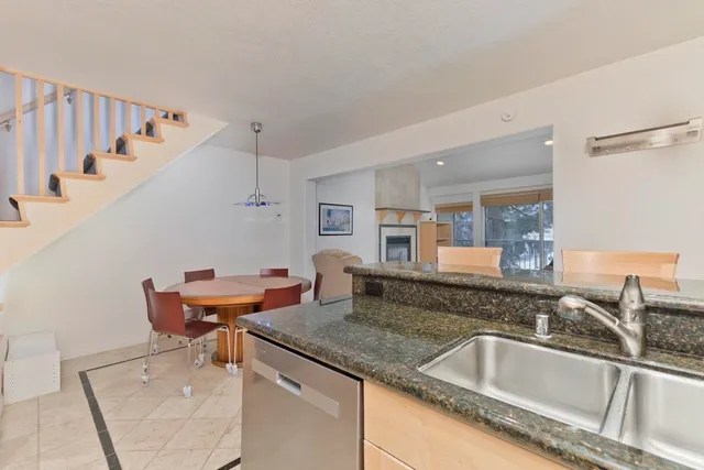 a kitchen with a sink and a refrigerator