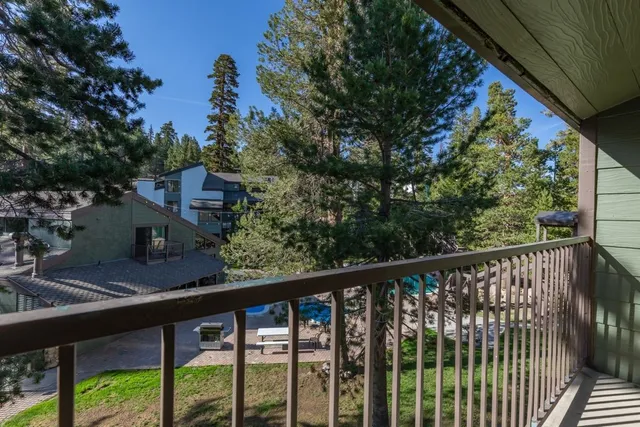 a view of a balcony with a pot