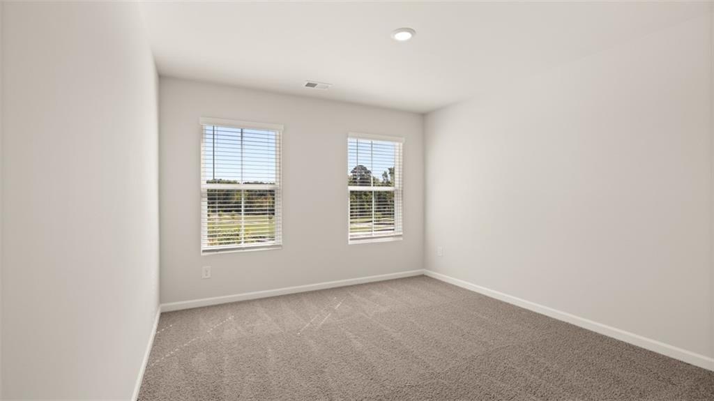 906 Stow Lane Monroe, GA 30655 - Photo 24 of 28 an empty room with a window