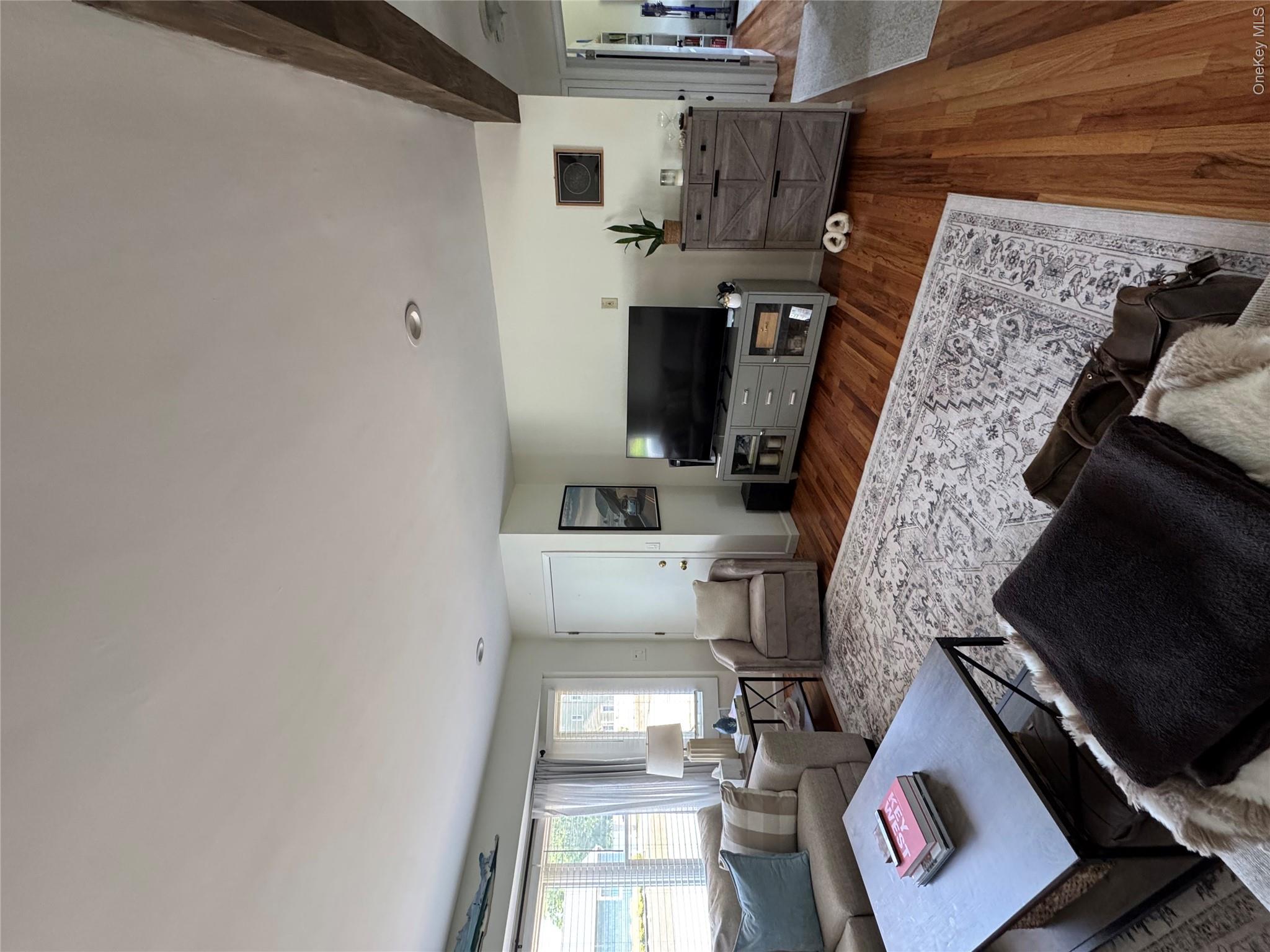 338 Carnation Road West Islip, NY 11795 - Photo 5 of 18 Hardwood flooring throughout a spacious living area featuring recessed lighting