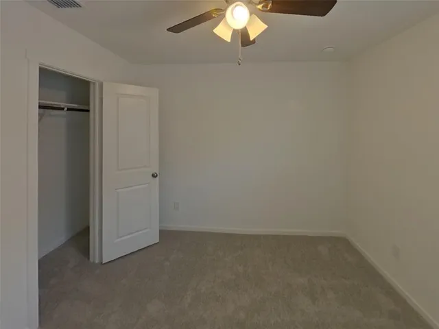 a view of a livingroom with a ceiling fan