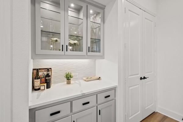 1825 Rough Rdg Trail Midlothian, TX 76065 - Photo 13 of 37 Built-in cabinetry with glass-front upper cabinets and under-cabinet lighting