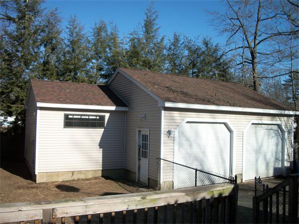 26 Quentin Road Springfield, MA 01129 - Photo 11 of 13 a side view of a house with a garage