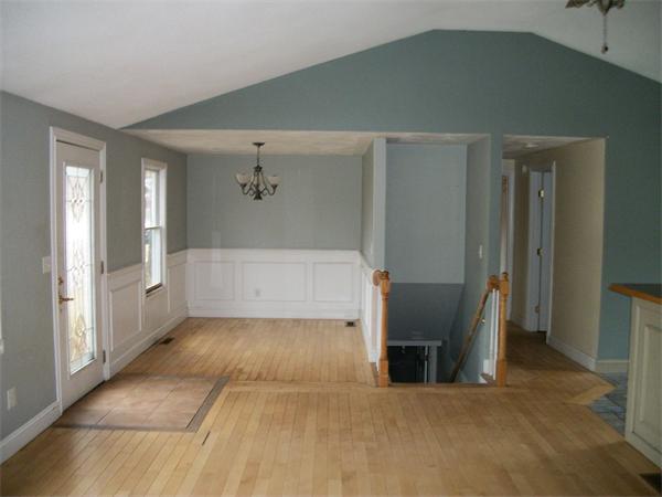 26 Quentin Road Springfield, MA 01129 - Photo 3 of 13 a view of a hallway with wooden floor and a living room