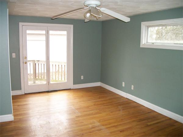 26 Quentin Road Springfield, MA 01129 - Photo 4 of 13 a view of an empty room with wooden floor and a window