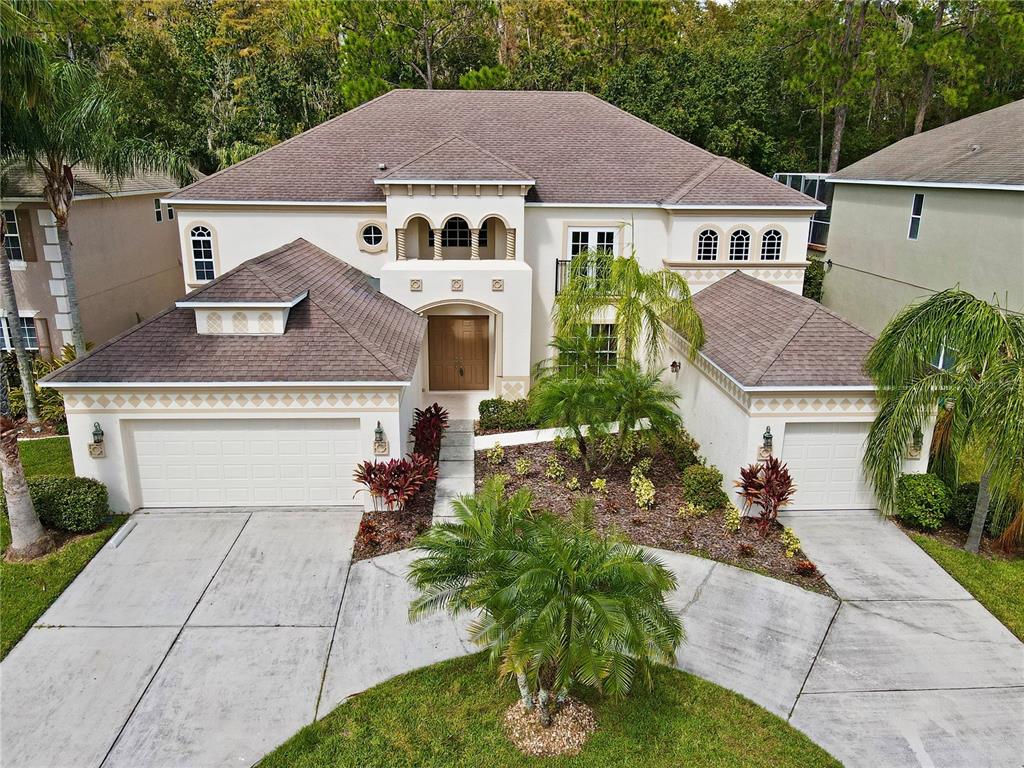 3453 Loggerhead Way Wesley Chapel, FL 33544 - Photo 1 of 1 a front view of a house with garden