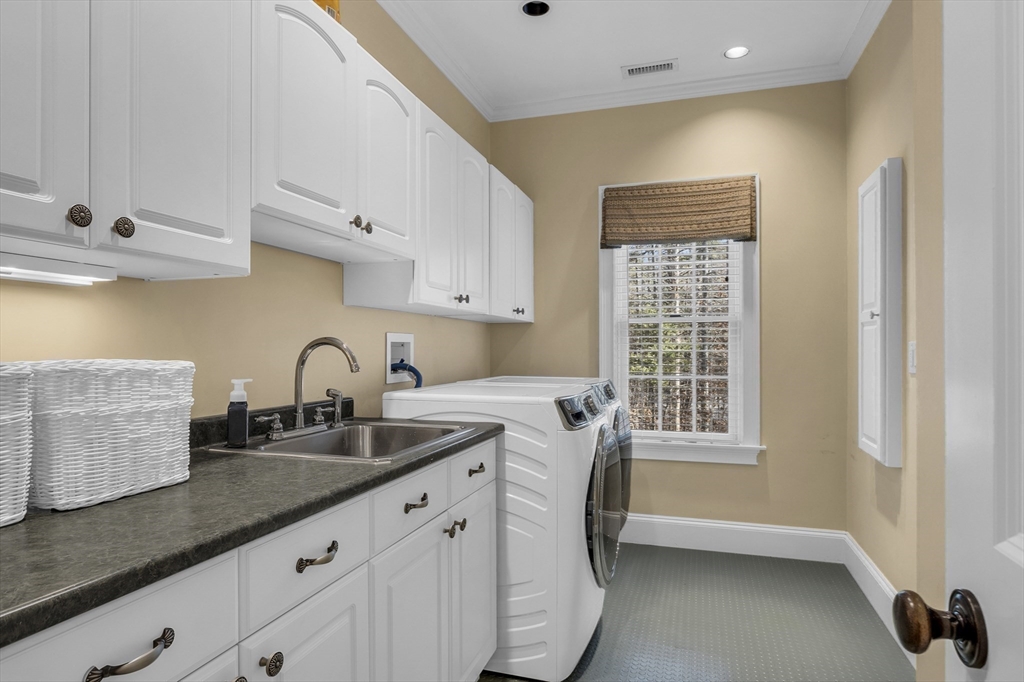 47 C Dana Road Boxford, MA 01921 - Photo 23 of 37 a kitchen with granite countertop a sink a stove and cabinets