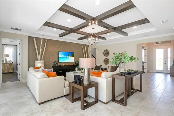 a kitchen with stainless steel appliances granite countertop a table chairs stove and kitchen island