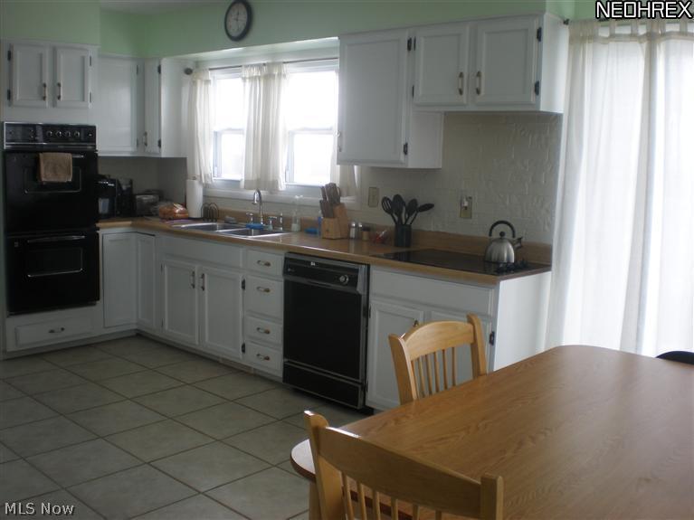 Kitchen has a double oven and dishwasher. Ceramic Tile Floor. Refrigerator Stays.