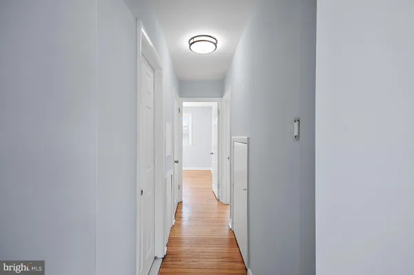 a view of a bathroom from the hallway