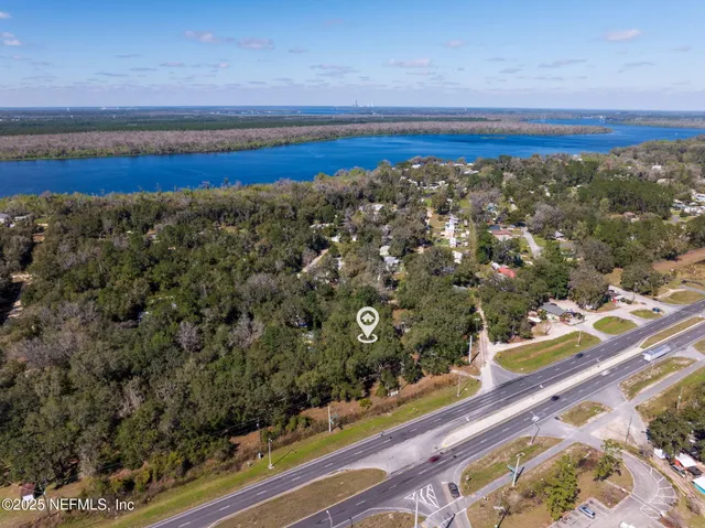 a view of road with large trees