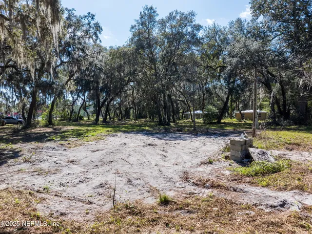 a view of street with trees on sides
