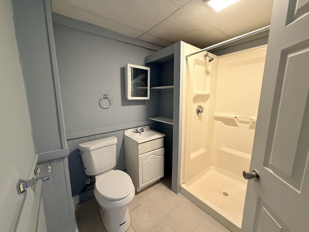 22 Knowlton Street, Unit 6 Gardner, MA 01440 - Photo 3 of 9 a white toilet sitting next to a bathroom sink