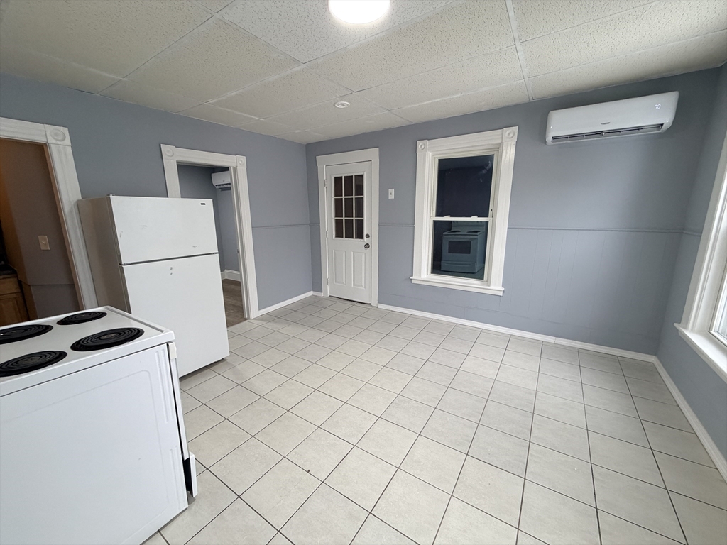 22 Knowlton Street, Unit 6 Gardner, MA 01440 - Photo 8 of 9 a view of a kitchen with storage and utility