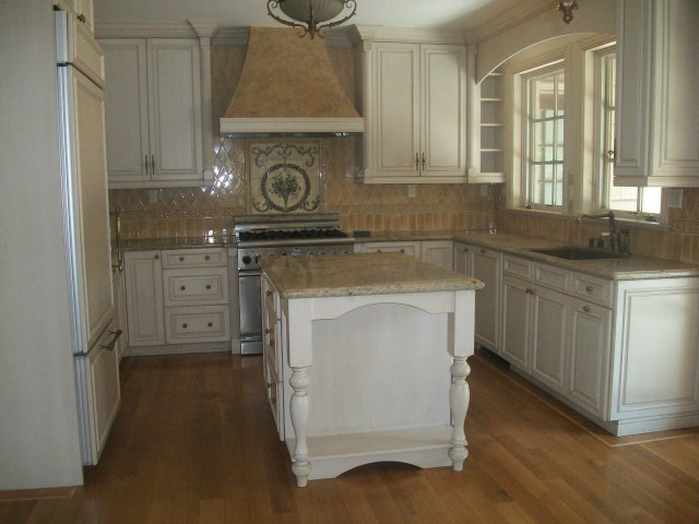 512 Primrose Road, Unit 102 Burlingame, CA 94010 - Photo 12 of 20 a kitchen with white cabinets and sink