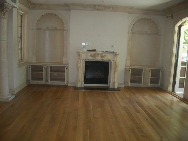 512 Primrose Road, Unit 102 Burlingame, CA 94010 - Photo 14 of 20 an empty room with wooden floor fireplace and windows