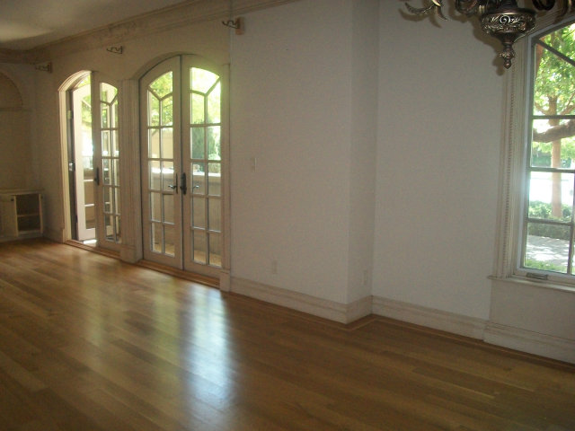 512 Primrose Road, Unit 102 Burlingame, CA 94010 - Photo 16 of 20 an empty room with wooden floor and windows