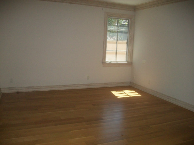 512 Primrose Road, Unit 102 Burlingame, CA 94010 - Photo 20 of 20 a view of empty room with wooden floor and fan