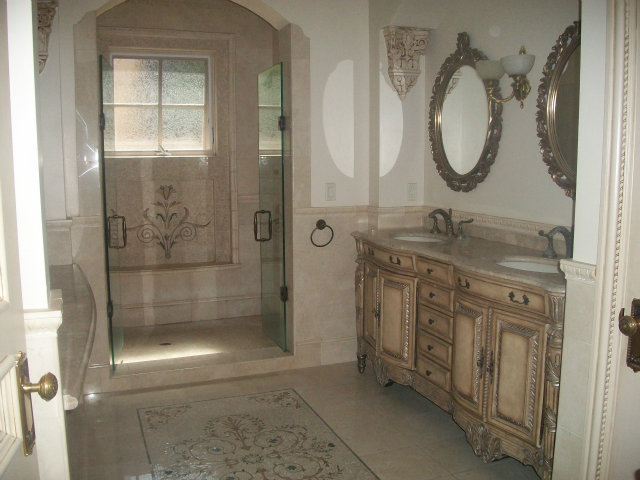 512 Primrose Road, Unit 102 Burlingame, CA 94010 - Photo 8 of 20 a bathroom with a granite countertop sink a mirror and a shower