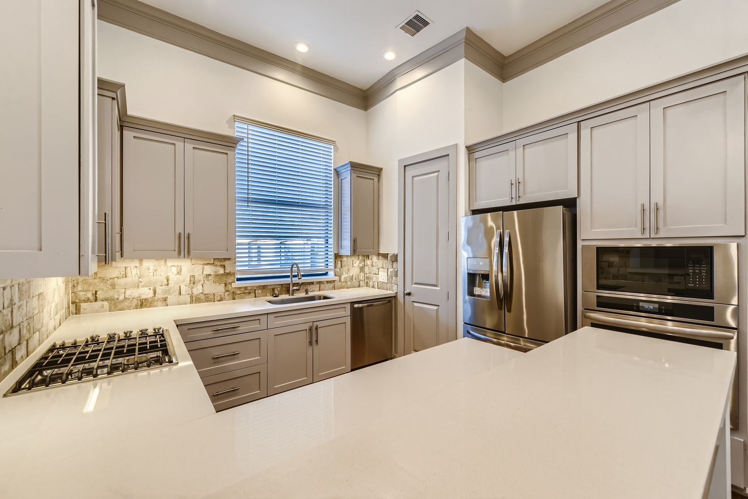 2208 Arabelle Street Houston, TX 77007 - Photo 3 of 26 a kitchen with stainless steel appliances a stove a sink and a refrigerator