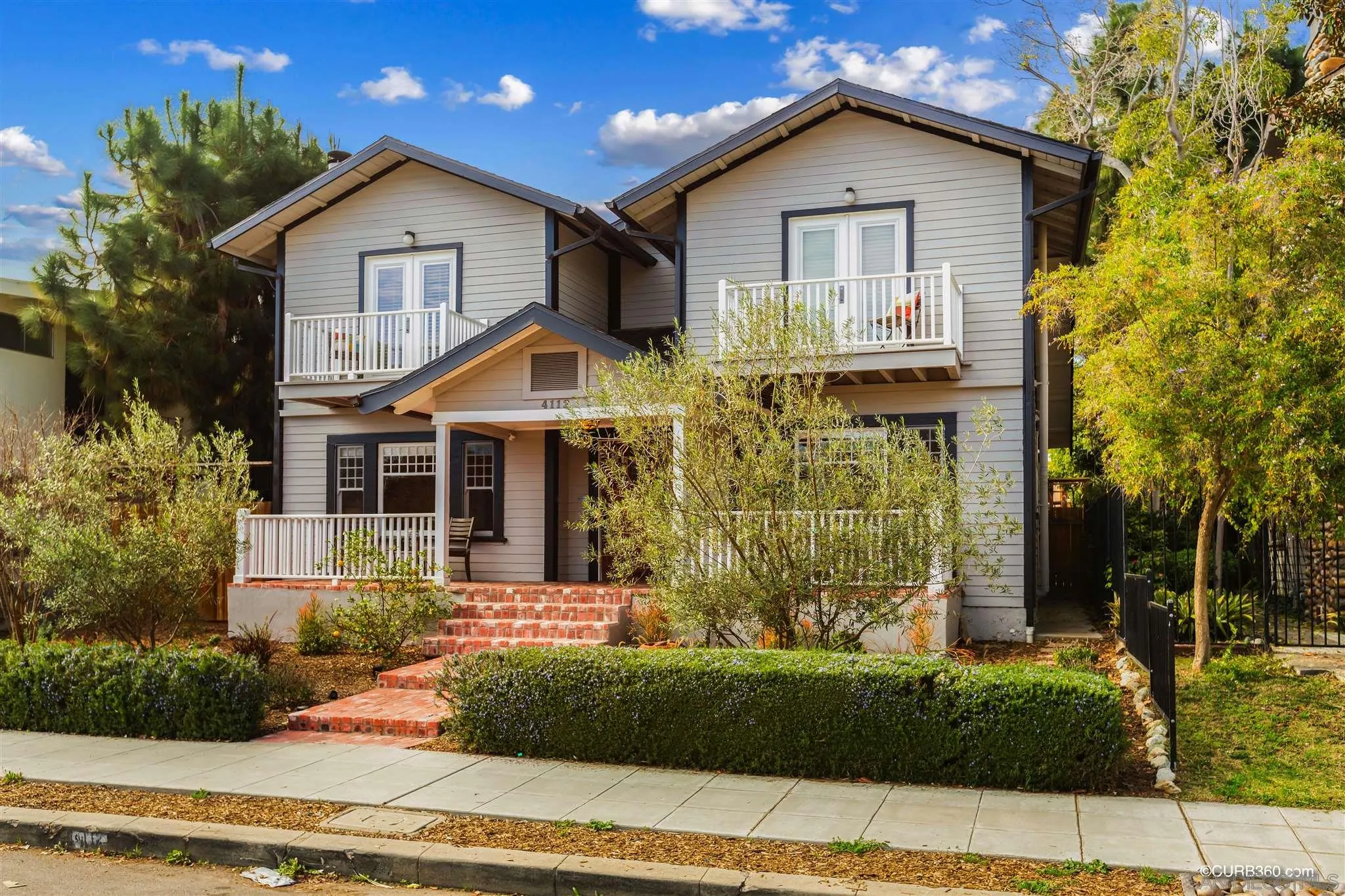 4112 Jackdaw Street San Diego, CA 92103 - Photo 1 of 34 a front view of a house with garden