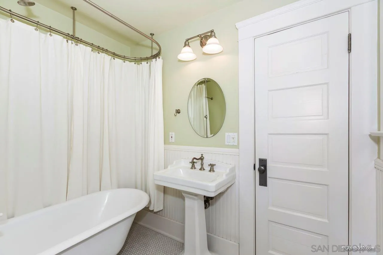 4112 Jackdaw Street San Diego, CA 92103 - Photo 14 of 34 a bathroom with a sink a toilet and shower