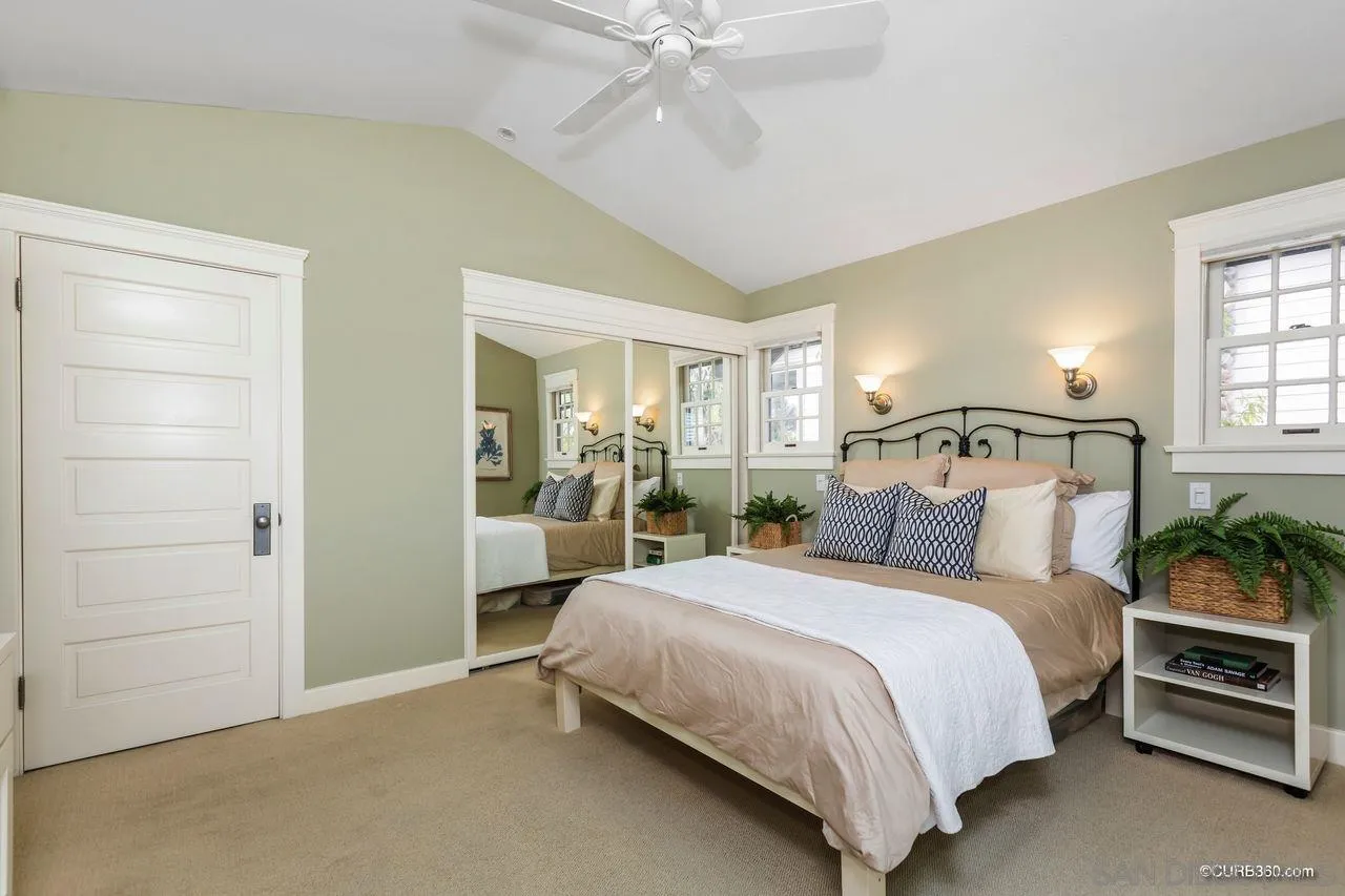 4112 Jackdaw Street San Diego, CA 92103 - Photo 19 of 34 a bedroom with a bed and a chandelier