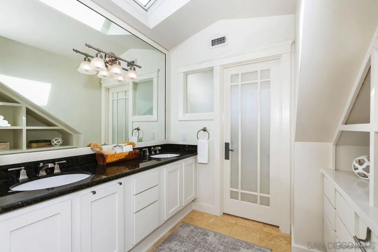 4112 Jackdaw Street San Diego, CA 92103 - Photo 21 of 34 a bathroom with a sink and a mirror