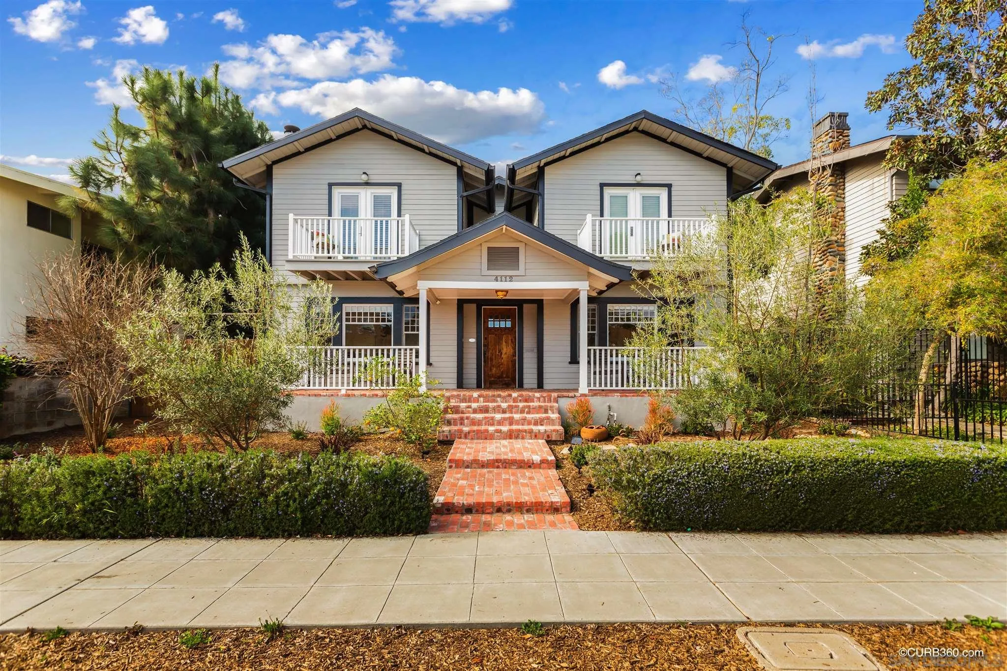 4112 Jackdaw Street San Diego, CA 92103 - Photo 33 of 34 a front view of a house with a yard