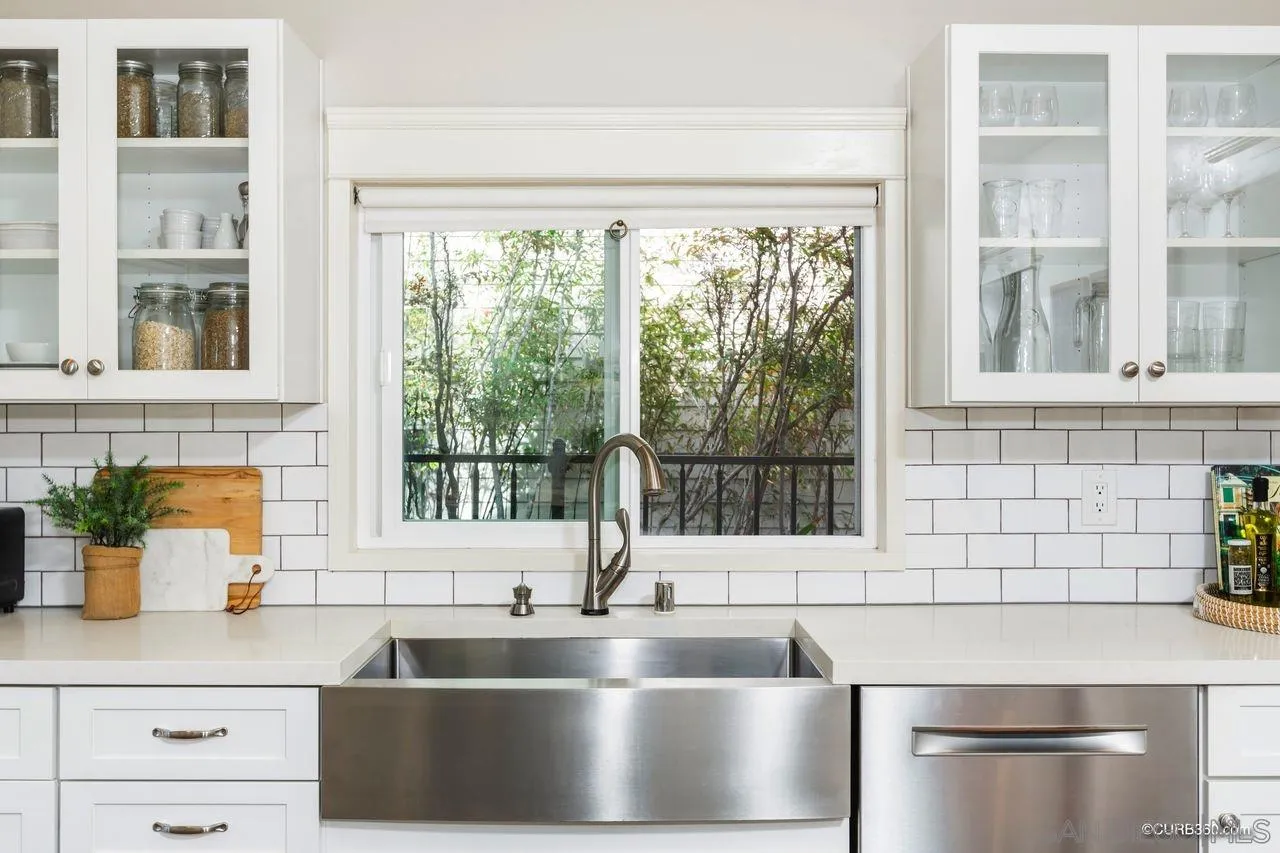 4112 Jackdaw Street San Diego, CA 92103 - Photo 9 of 34 a kitchen with a sink and a window